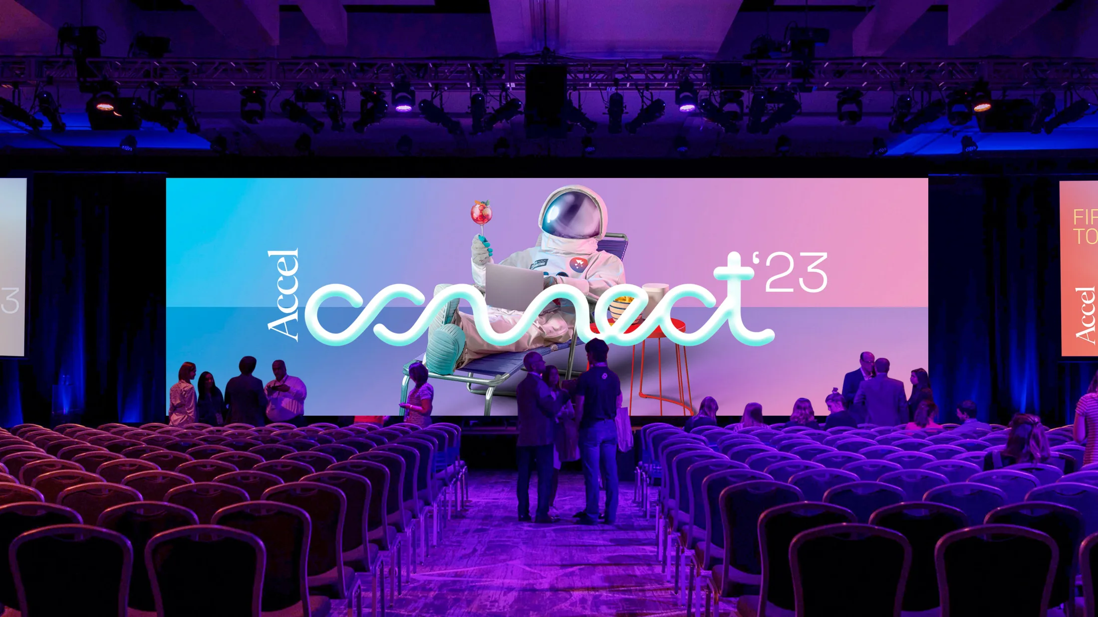 Accel Connect main-hall stage, a wide LED screen showing the key visual above rows of delegate seating