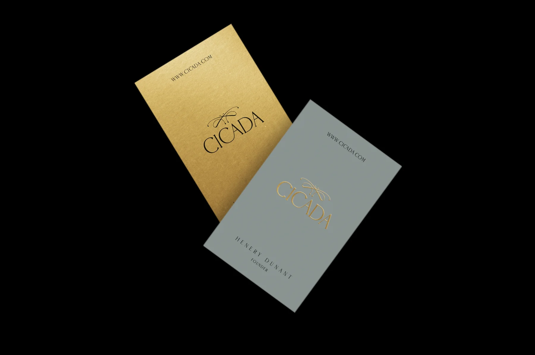 Two Cicada business cards, one gold and one grey, each with the emblem and wordmark