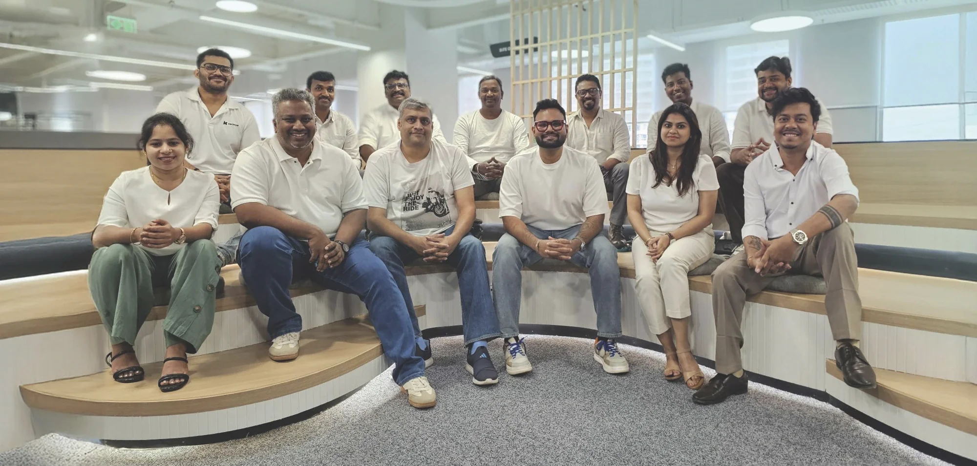 The Kenvue design team gathered together in the studio, smiling for a group photo