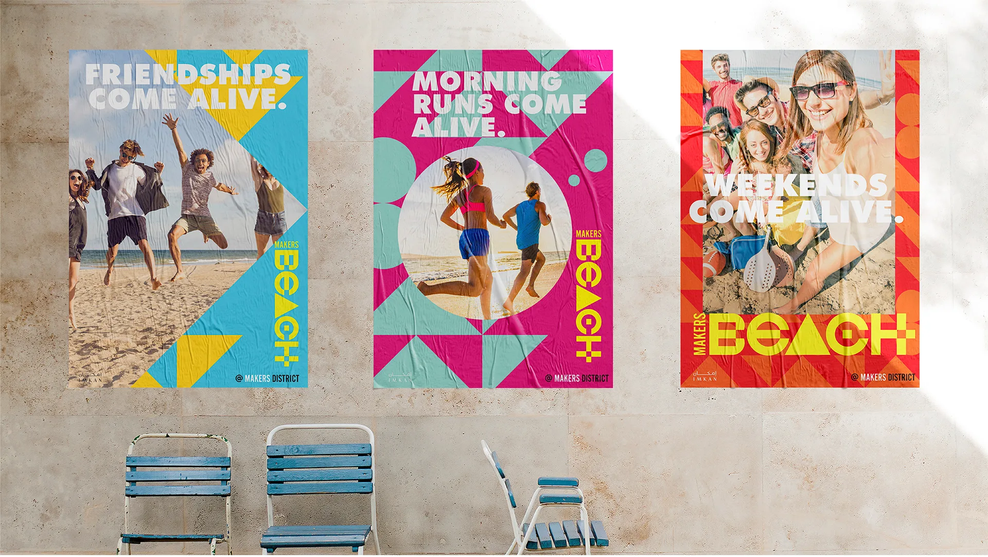 Three Makers Beach posters pasted on an outdoor wall, each reading a different ‘Come alive’ line over beach photography
