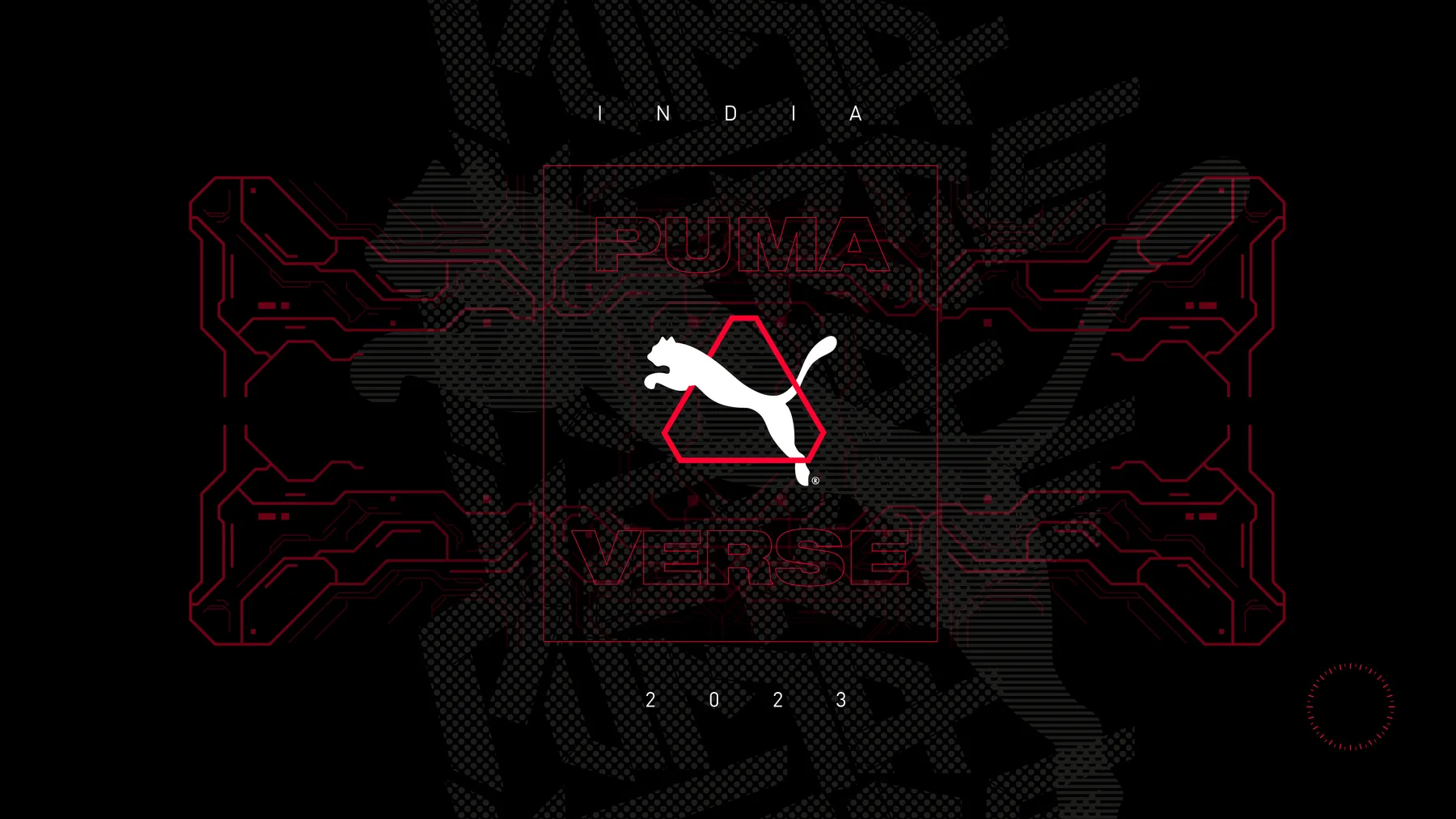 The Pumaverse badge lockup in Puma red: a hexagonal HUD frame around the leaping cat, with ‘PUMA / VERSE’ and ‘2023’ set inside a circuit-line pattern